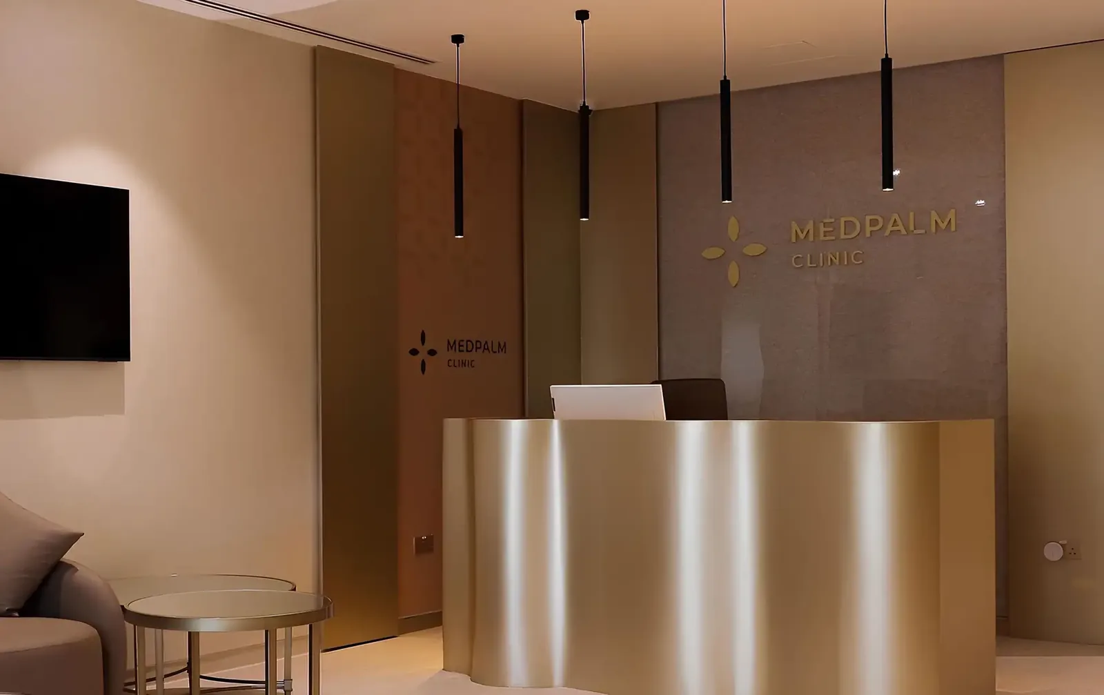 Reception desk and branded wall inside Medpalm Polyclinic in Dubai