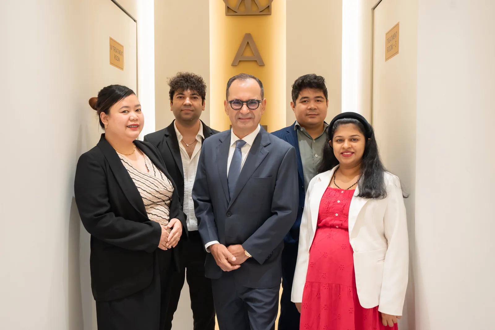 Team gathering at an AAMC clinic milestone in Dubai